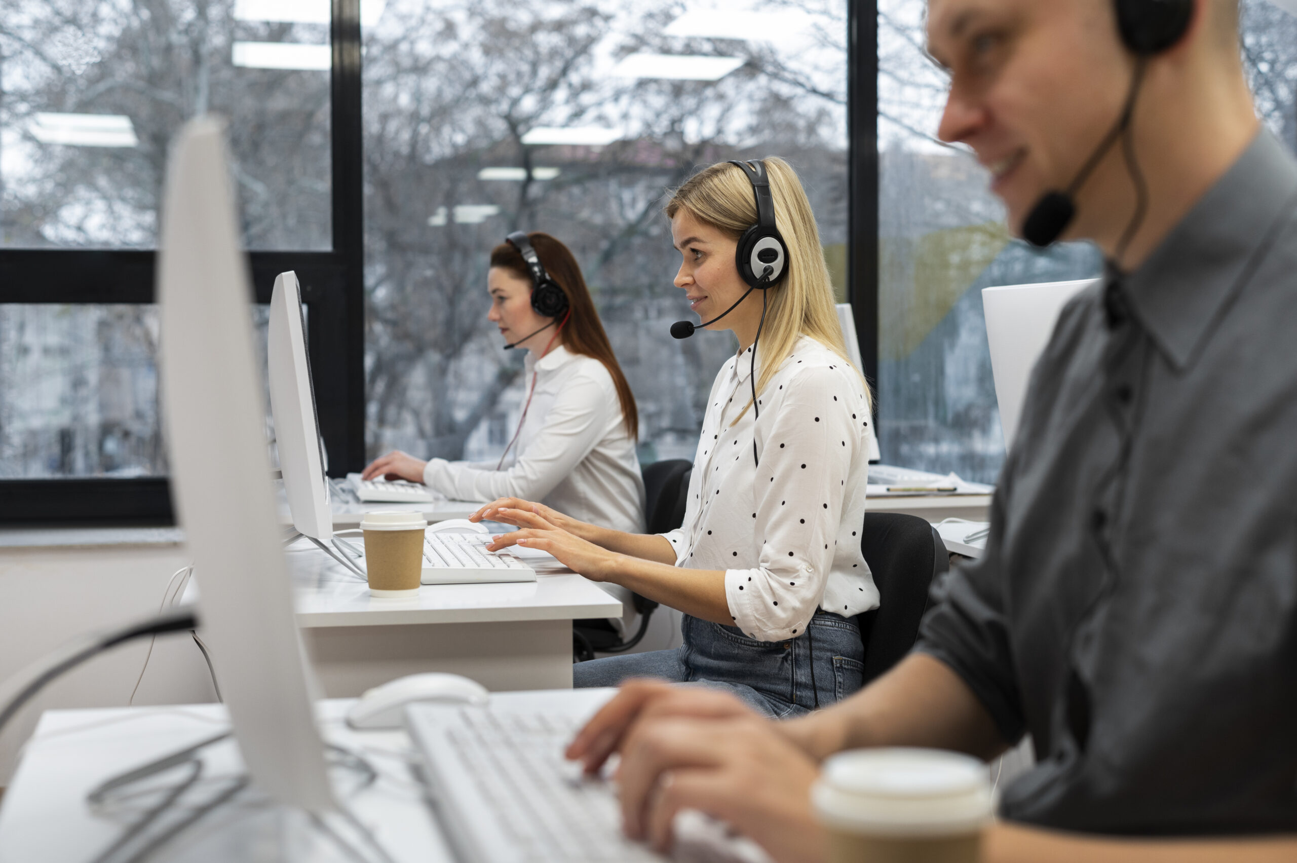 colleagues-working-together-call-center-office-with-coffee