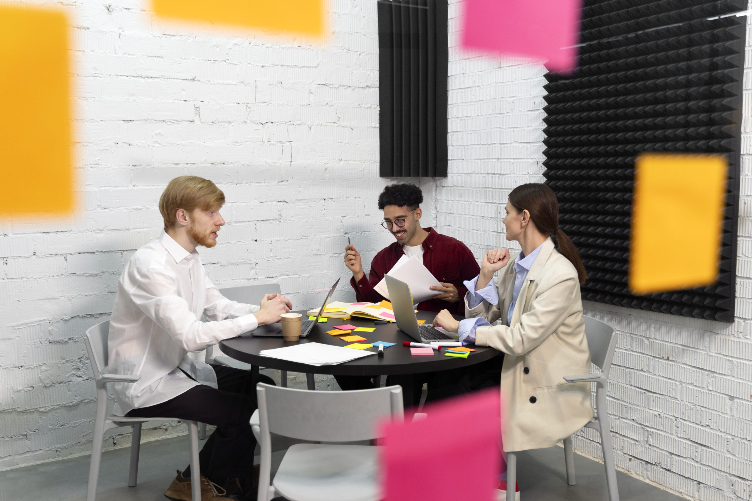 full-shot-colleagues-sitting-table